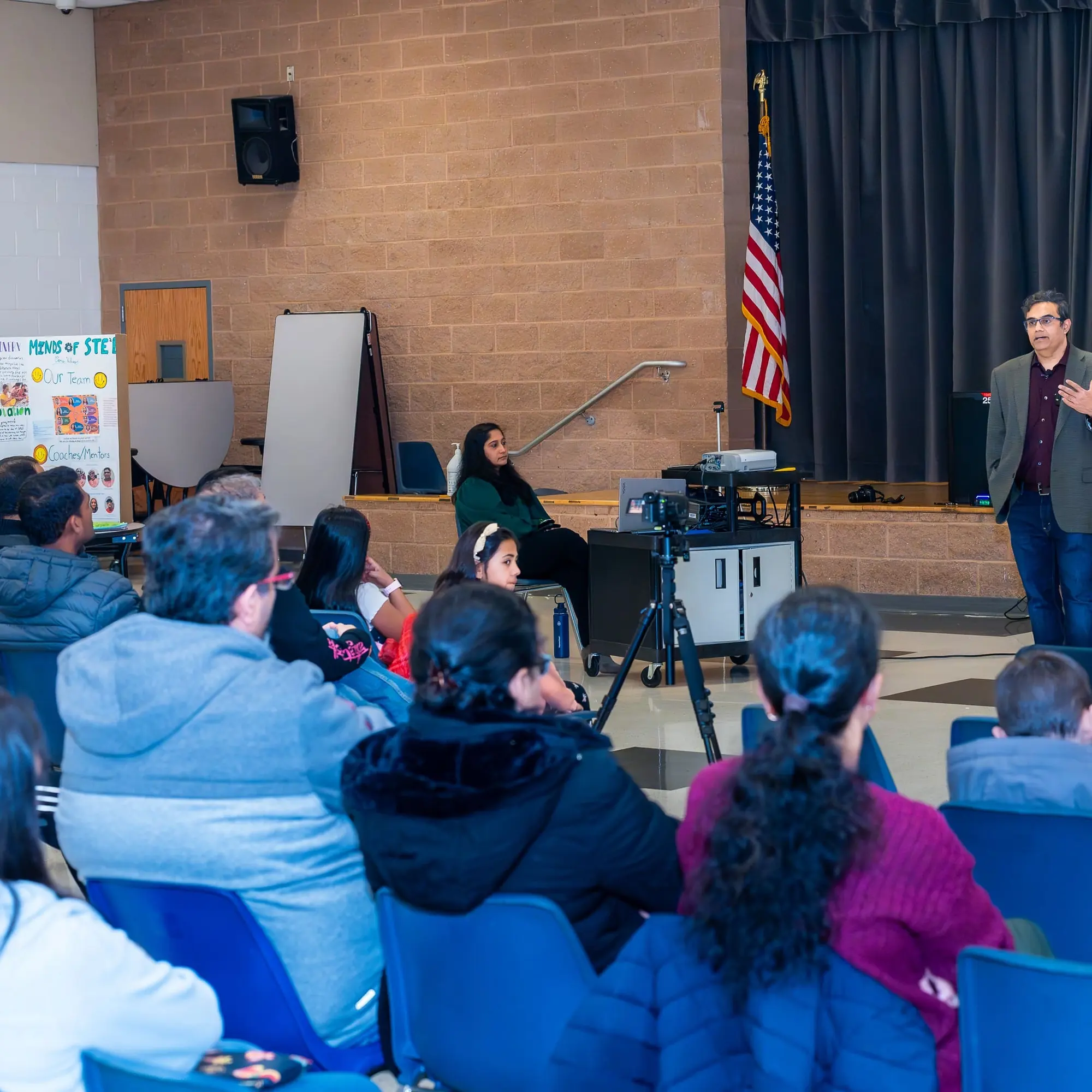 Audience members listen during a Sangat community conversation
