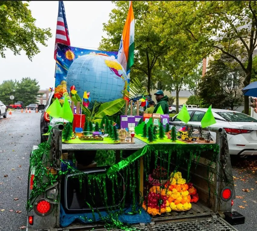 A decorated float with flags and fruit prepared for the sensory-friendly Diwali Parade