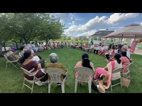 Seniors gathered outdoors at the Sanskriti summer picnic